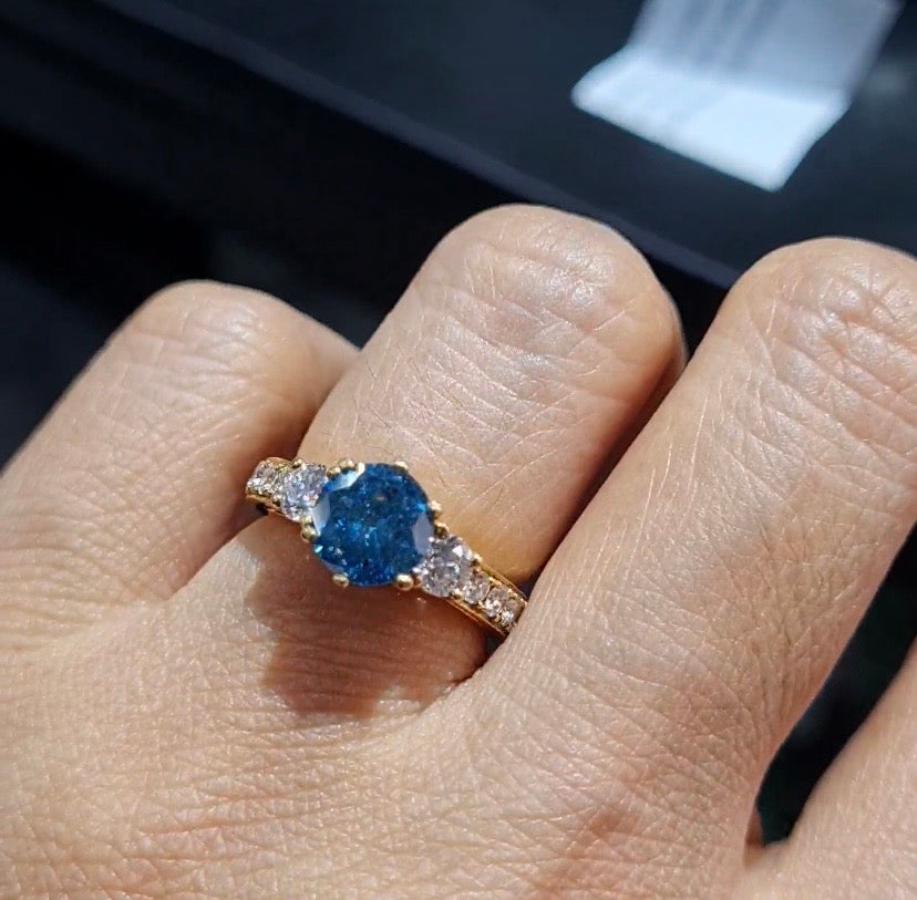 Fancy Blue Diamond Elevated Paved Diamond Engagement Ring 18K